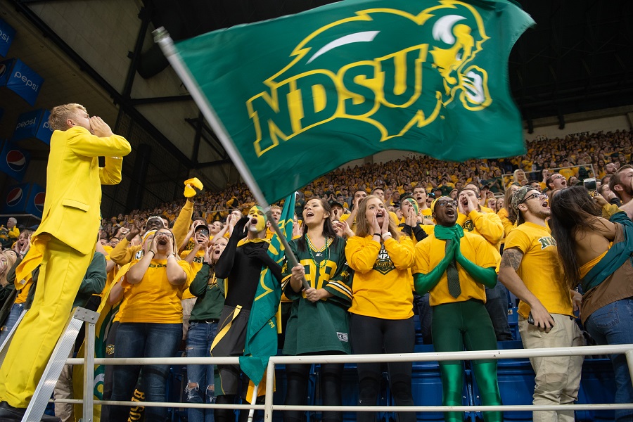Photo: Student fans cheer on the team at a Bison football game
